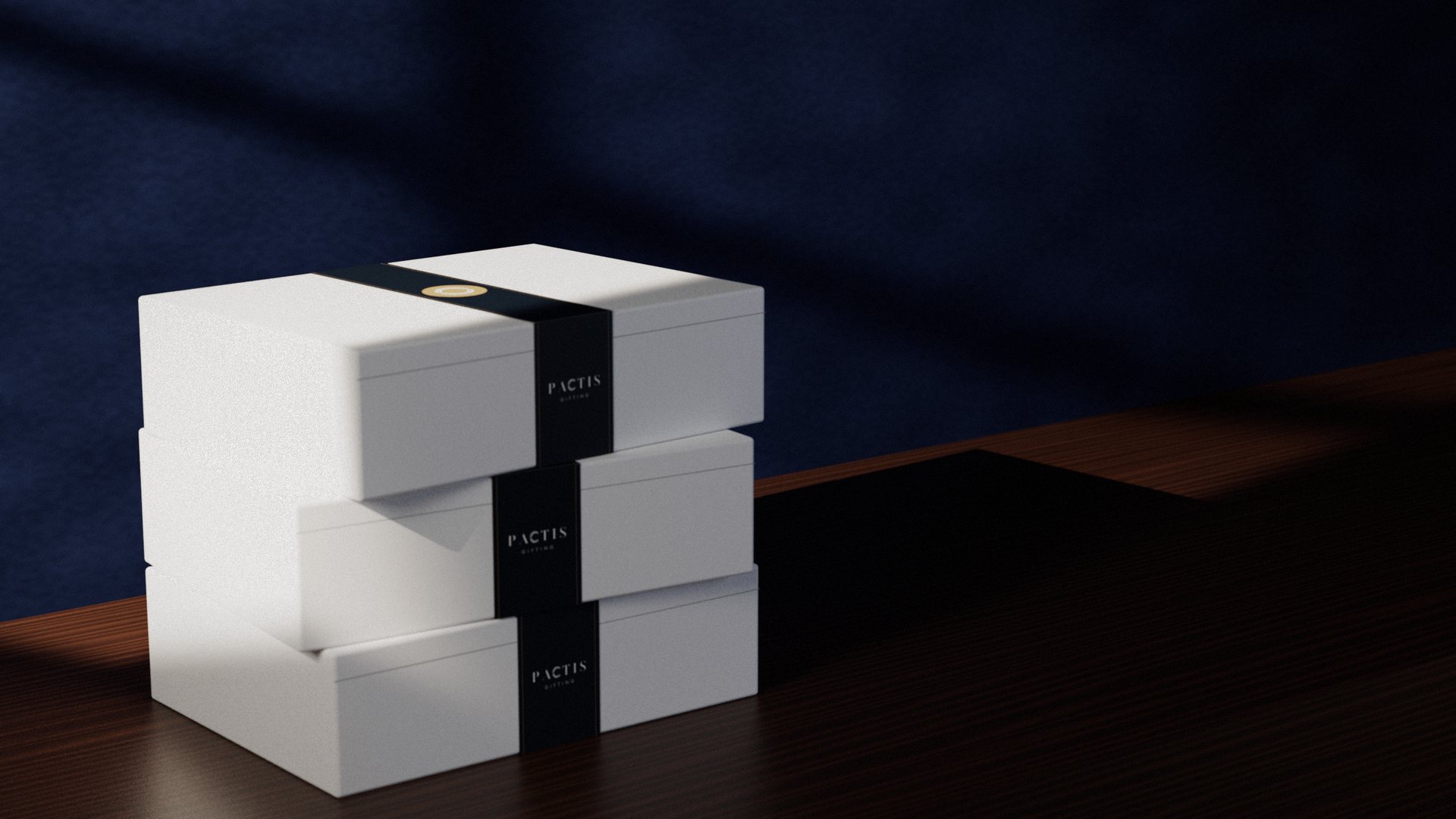 Three white Pactis gift boxes stacked on a walnut sideboard, each wrapped in a navy band